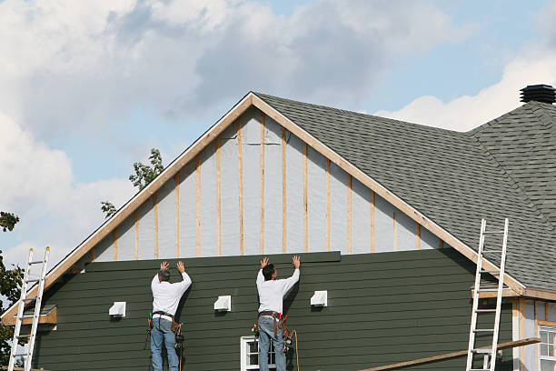 Professional Siding Contractor technician working in Islip, NY